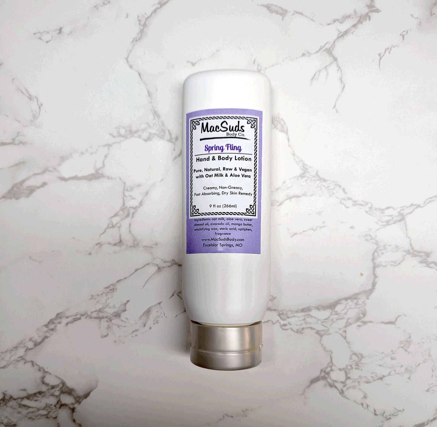 Handmade Spring Fling Lotion in a 9 oz upside-down bottle, moisturizing body lotion with a light floral gardenia and lily scent, perfect for spring skincare.