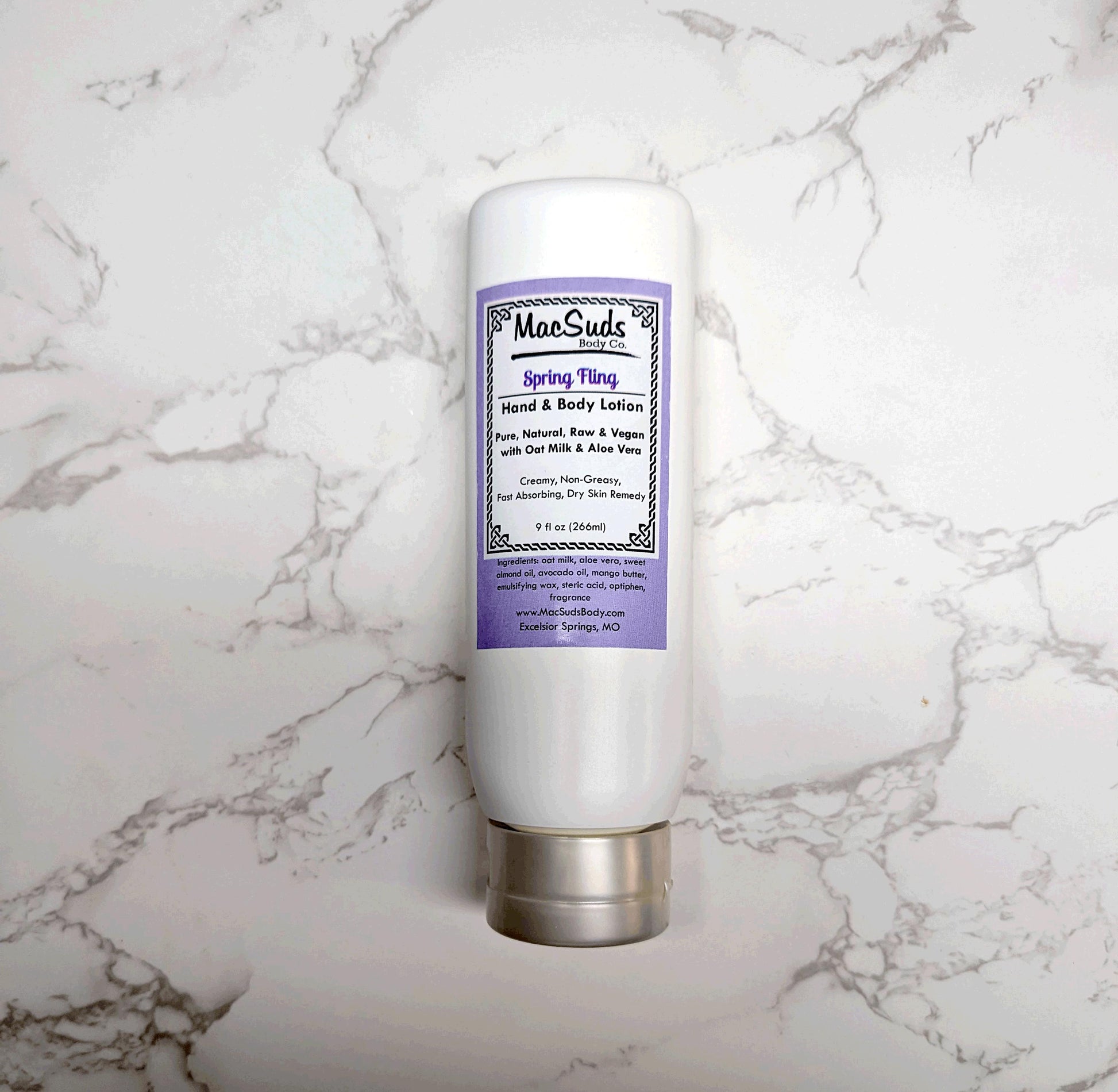Handmade Spring Fling Lotion in a 9 oz upside-down bottle, moisturizing body lotion with a light floral gardenia and lily scent, perfect for spring skincare.