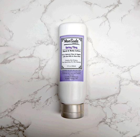 Handmade Spring Fling Lotion in a 9 oz upside-down bottle, moisturizing body lotion with a light floral gardenia and lily scent, perfect for spring skincare.